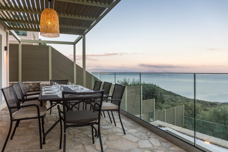 Natural landscape, Balcony/Terrace, Seating area, Dining area, Pool view, Sea view, Sunset