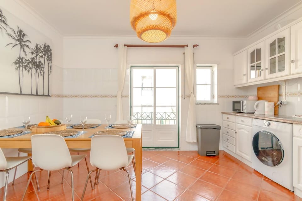 Kitchen or kitchenette, dishwasher, stove, toaster, washing machine