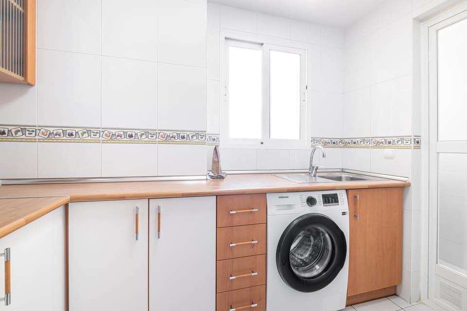 Kitchen or kitchenette, washing machine