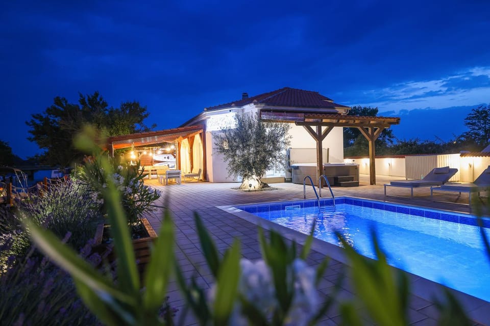 Property building, Night, Pool view, Swimming pool, sunbed