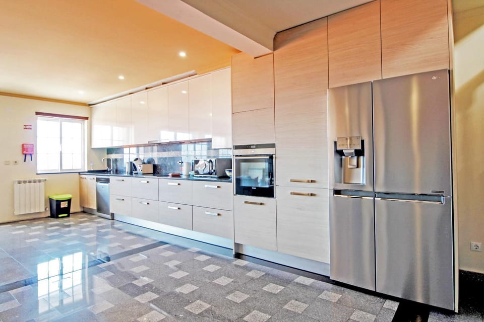 Kitchen or kitchenette, dishwasher, oven, stove