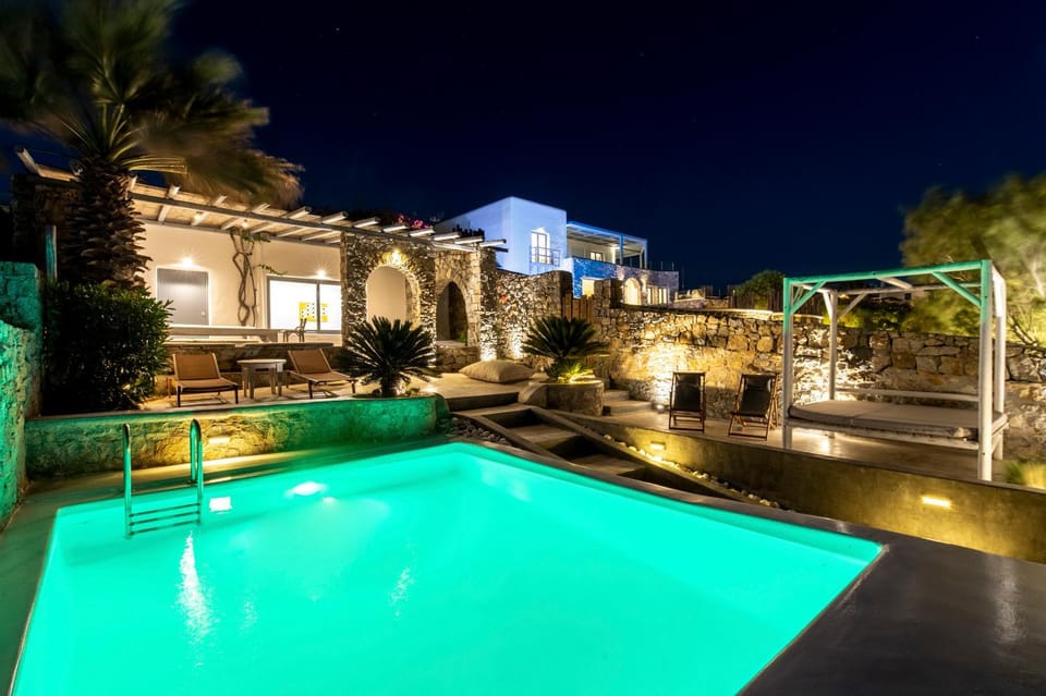 Property building, Patio, Night, Pool view, Swimming pool, Swimming pool, sunbed