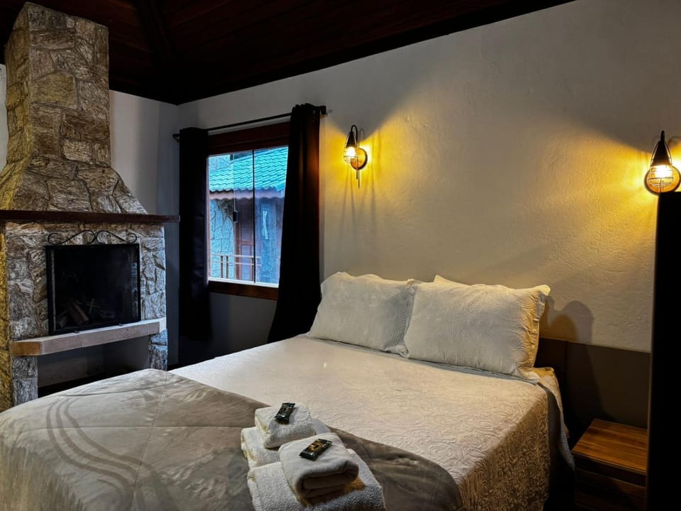 Bed, Photo of the whole room, Bedroom, fireplace, towels