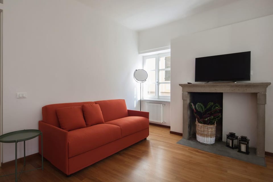 Bed, TV and multimedia, Living room, Seating area, air conditioner