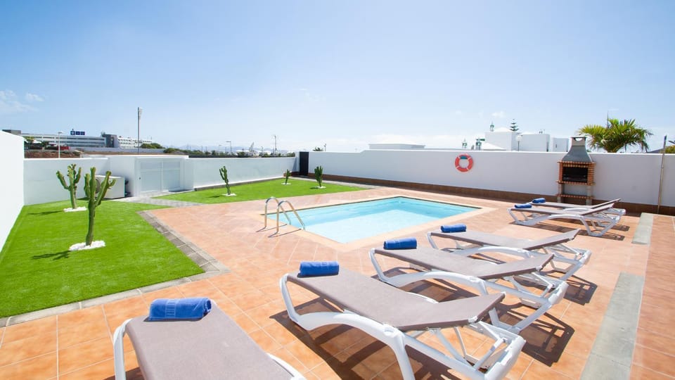 Property building, Natural landscape, BBQ facilities, Solarium, Seating area, Landmark view, Pool view, Swimming pool, heating, internet, sunbed, air conditioner