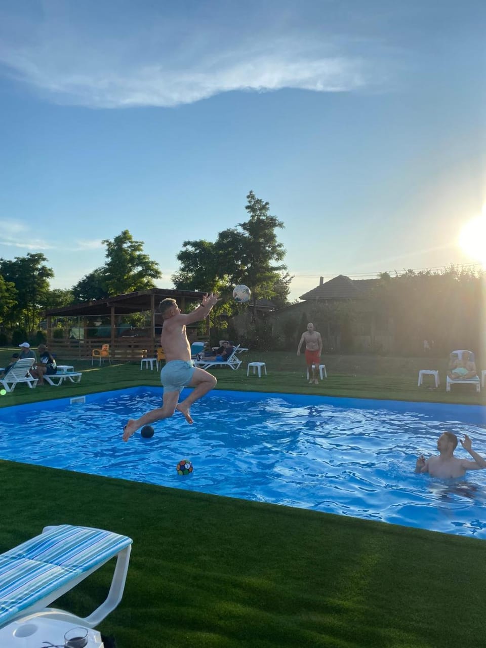 Natural landscape, Pool view, Swimming pool, Sunset, group of guests, sunbed