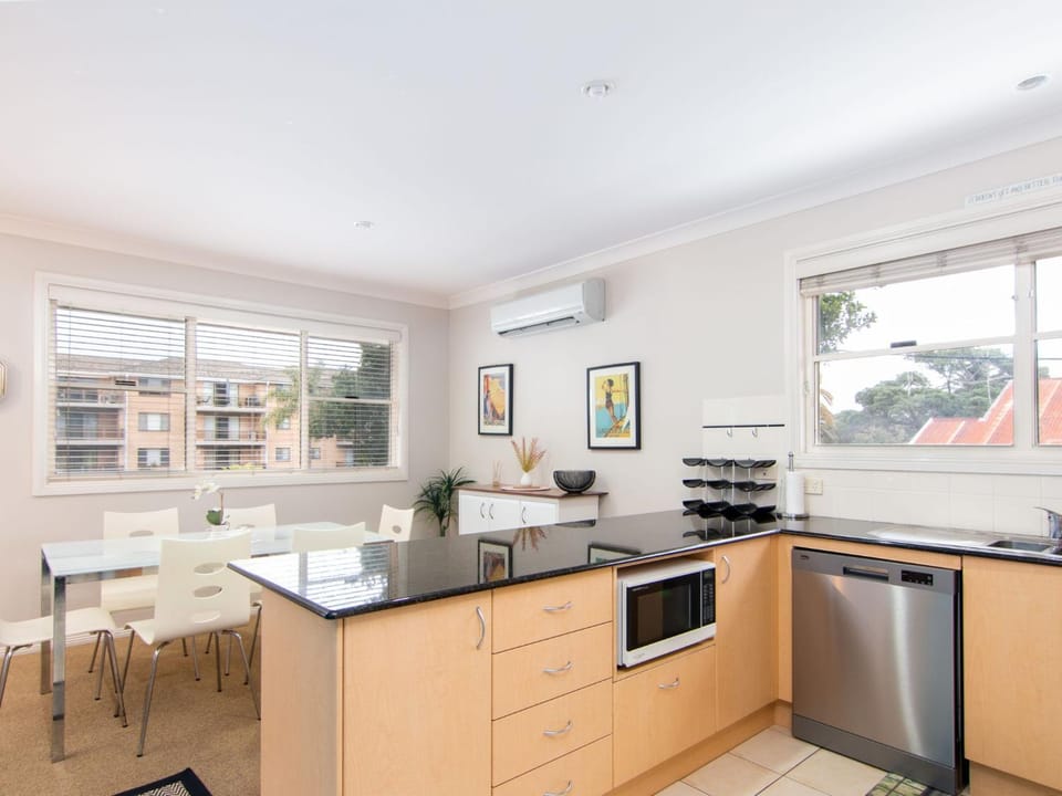 Kitchen or kitchenette, Dining area, dishwasher, oven, stove, air conditioner
