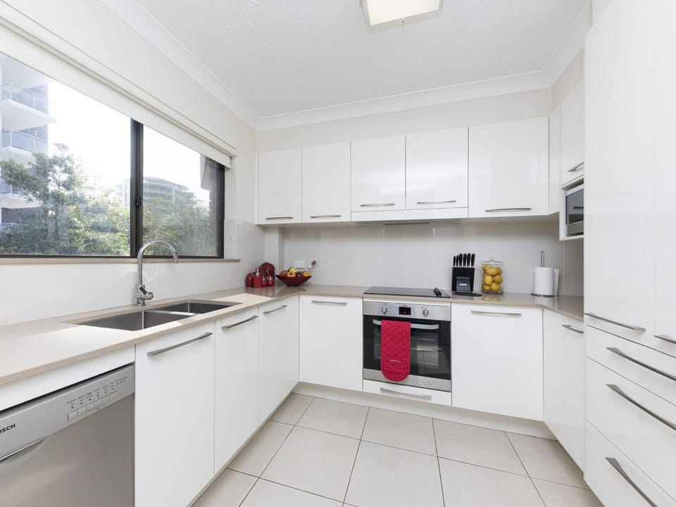 Kitchen or kitchenette, dishwasher, oven, stove