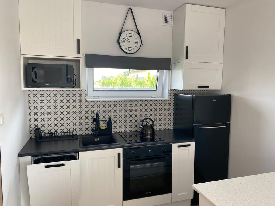 Kitchen or kitchenette, dishwasher, oven, stove, toaster