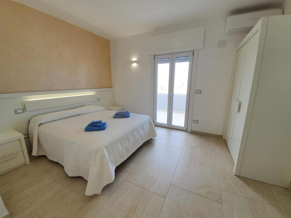Bed, Photo of the whole room, Decorative detail, Bedroom, furniture, hair dresser, towels, wardrobe, air conditioner