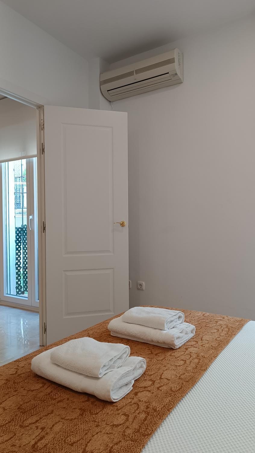 Bed, Bedroom, towels, wardrobe, air conditioner