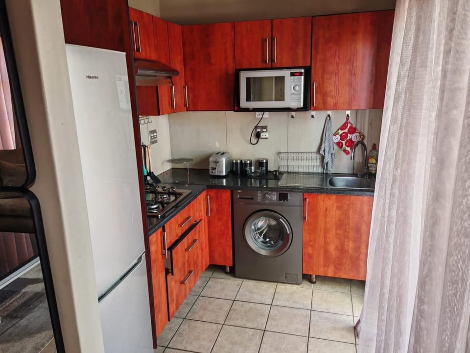 Kitchen or kitchenette, stove, washing machine