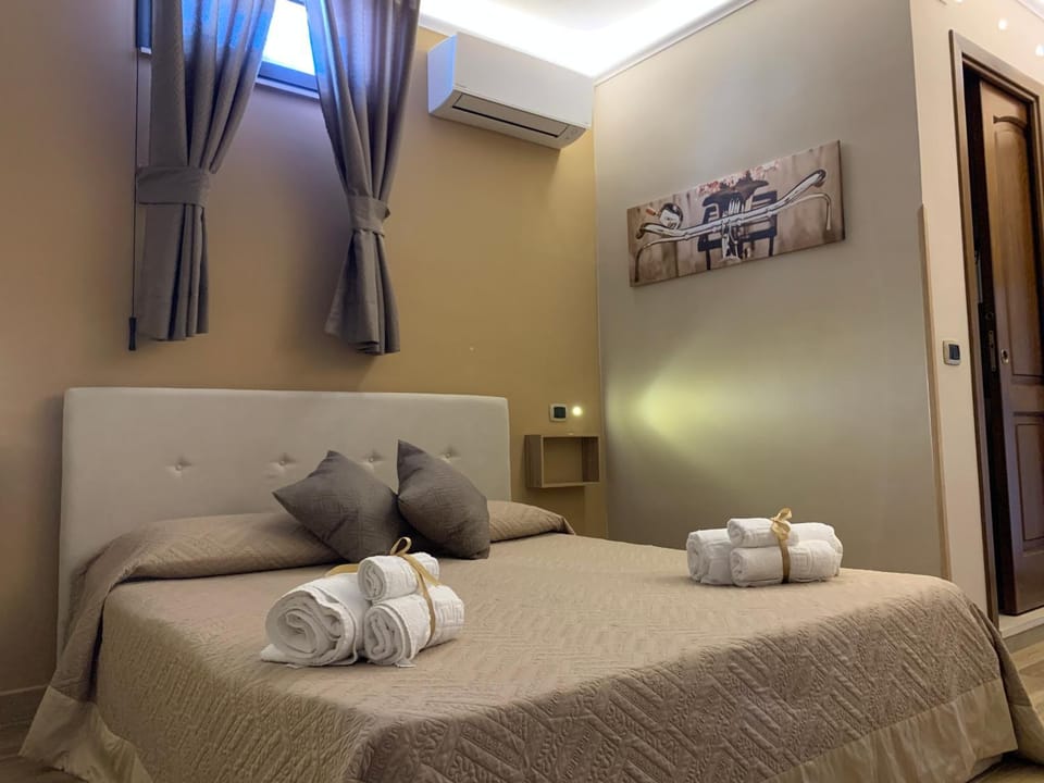 Bed, Photo of the whole room, Bedroom, towels, air conditioner