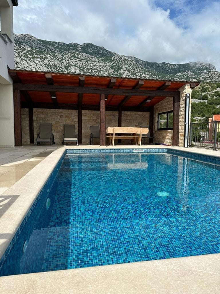 Beachfront House Robert with Pool Apartment in Lika-Senj County