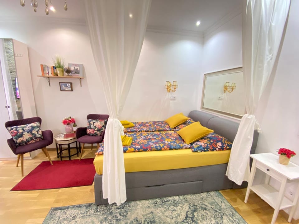 Bed, Living room, Seating area, Bedroom