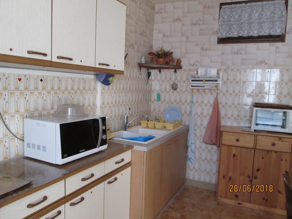 Kitchen or kitchenette, oven, stove, toaster