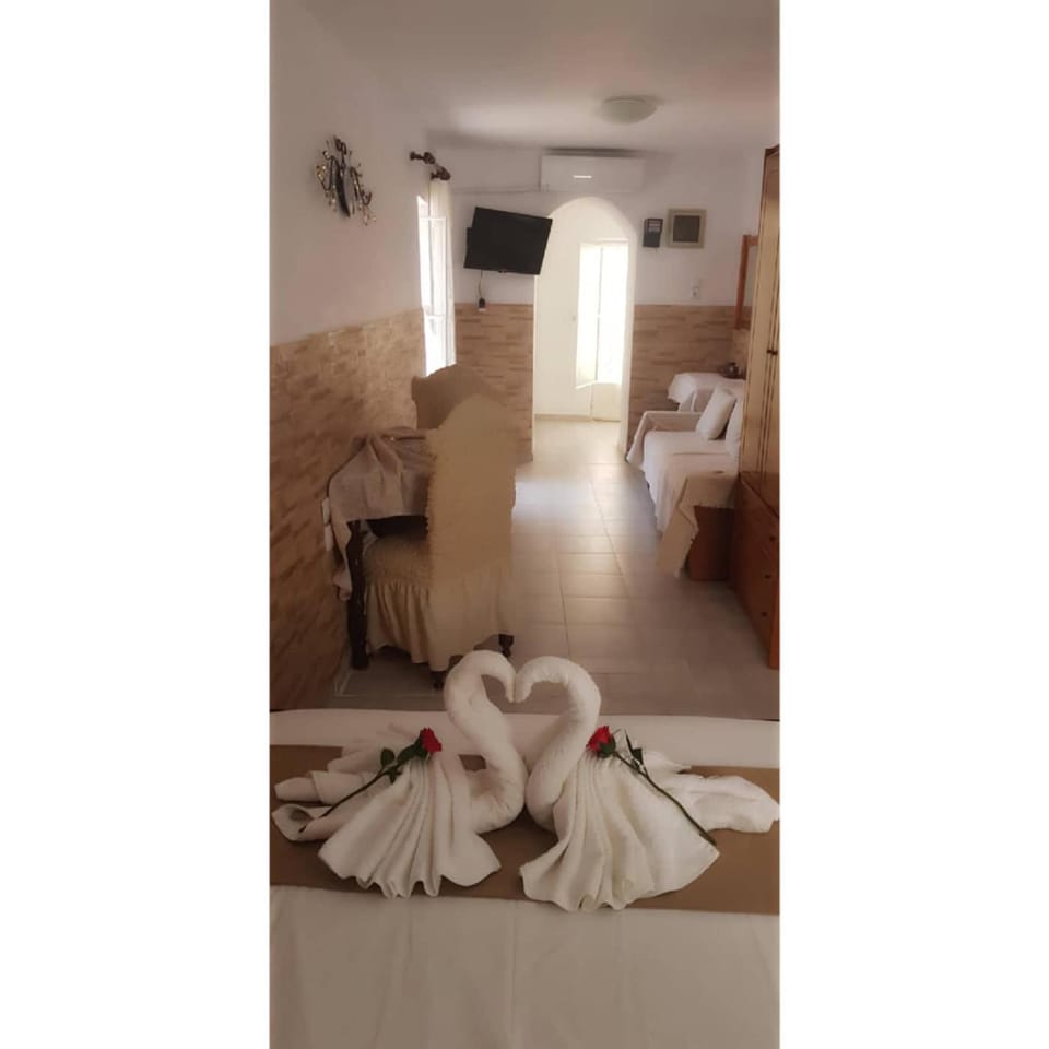 Bed, Living room, Seating area, Bedroom