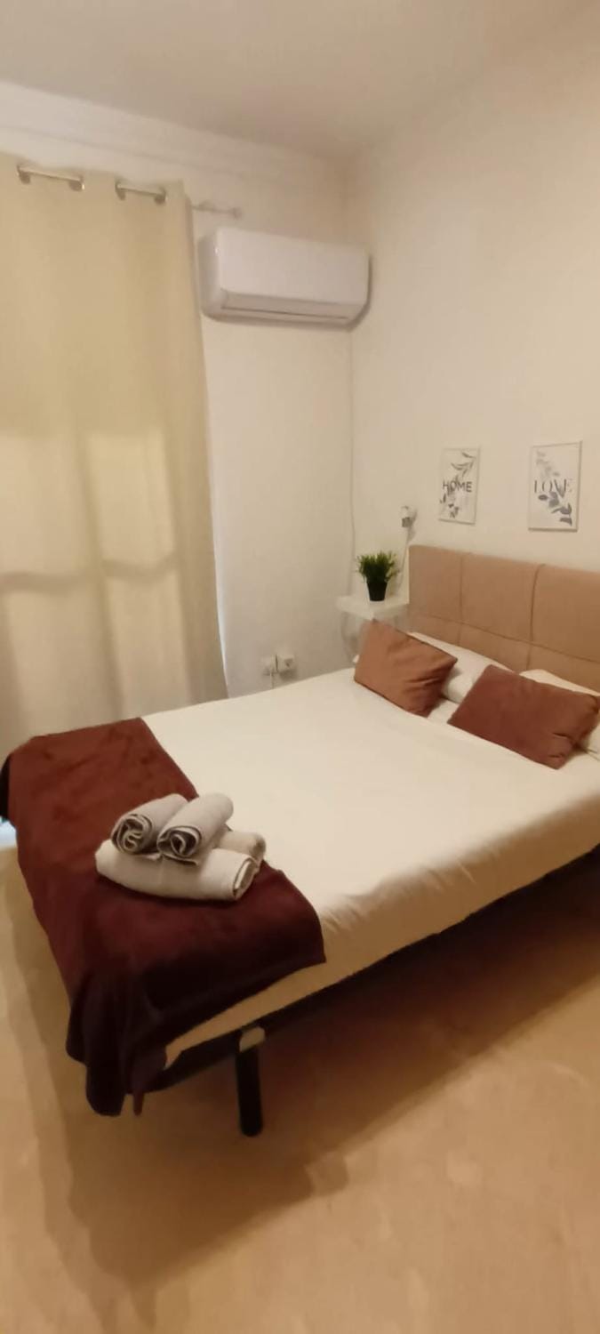 Bed, Photo of the whole room, Bedroom, towels, air conditioner