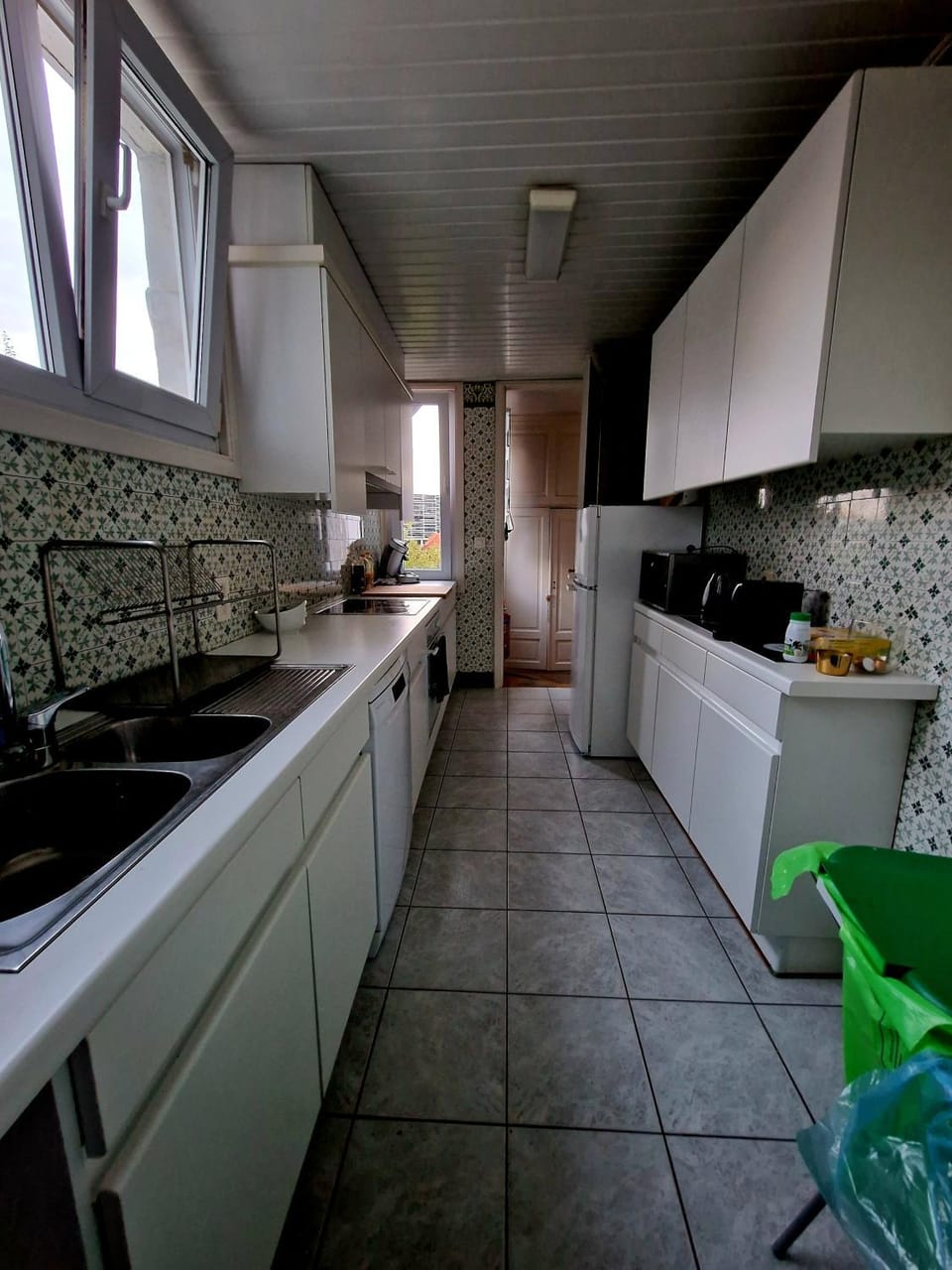 Kitchen or kitchenette, dishwasher, oven, stove