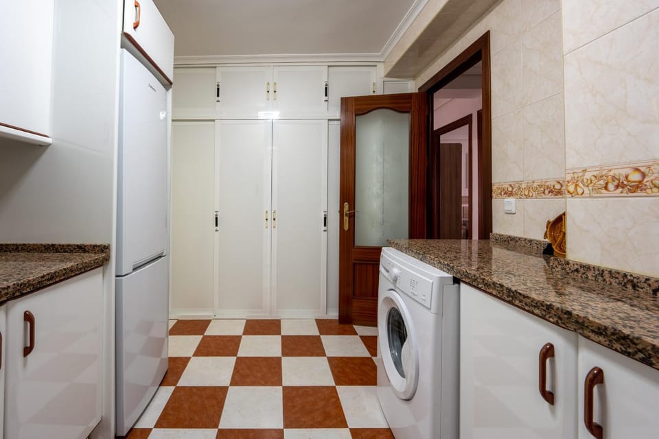 Kitchen or kitchenette, washing machine