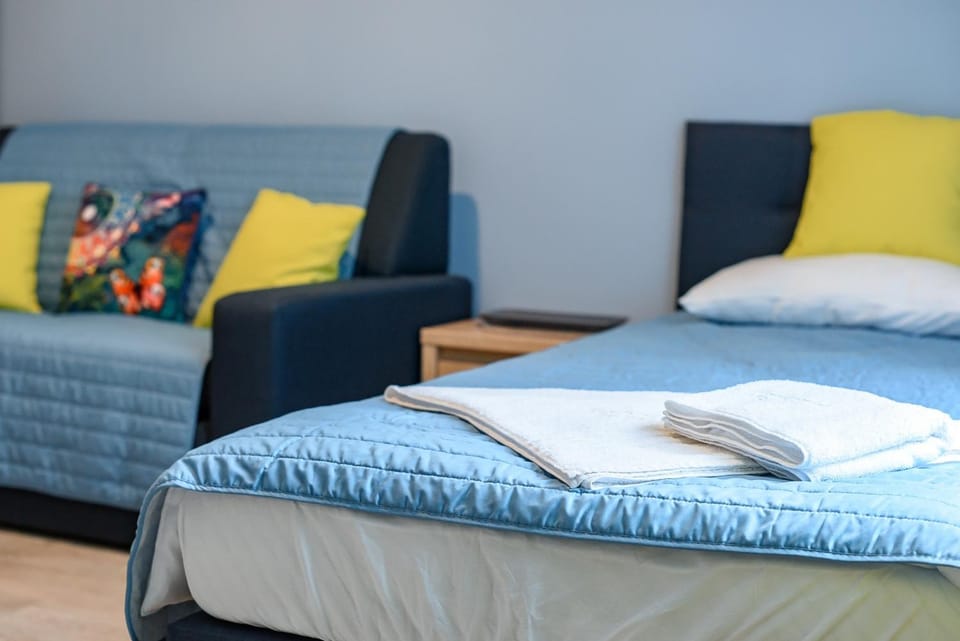 Bed, Living room, Seating area, Bedroom
