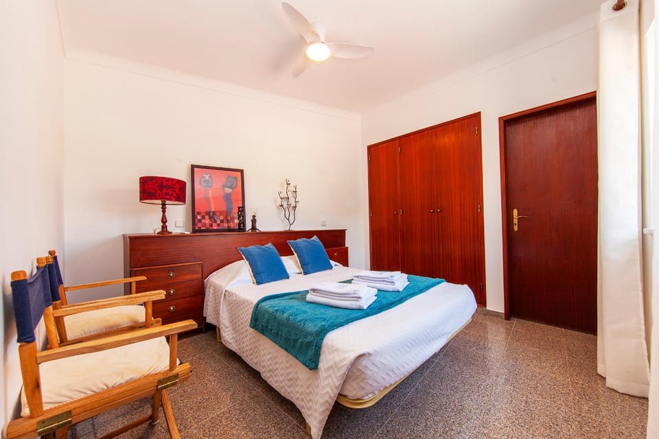 Bed, towels, wardrobe