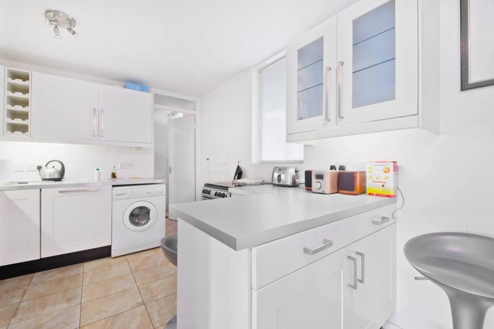 Kitchen or kitchenette, dishwasher, stove, toaster, washing machine