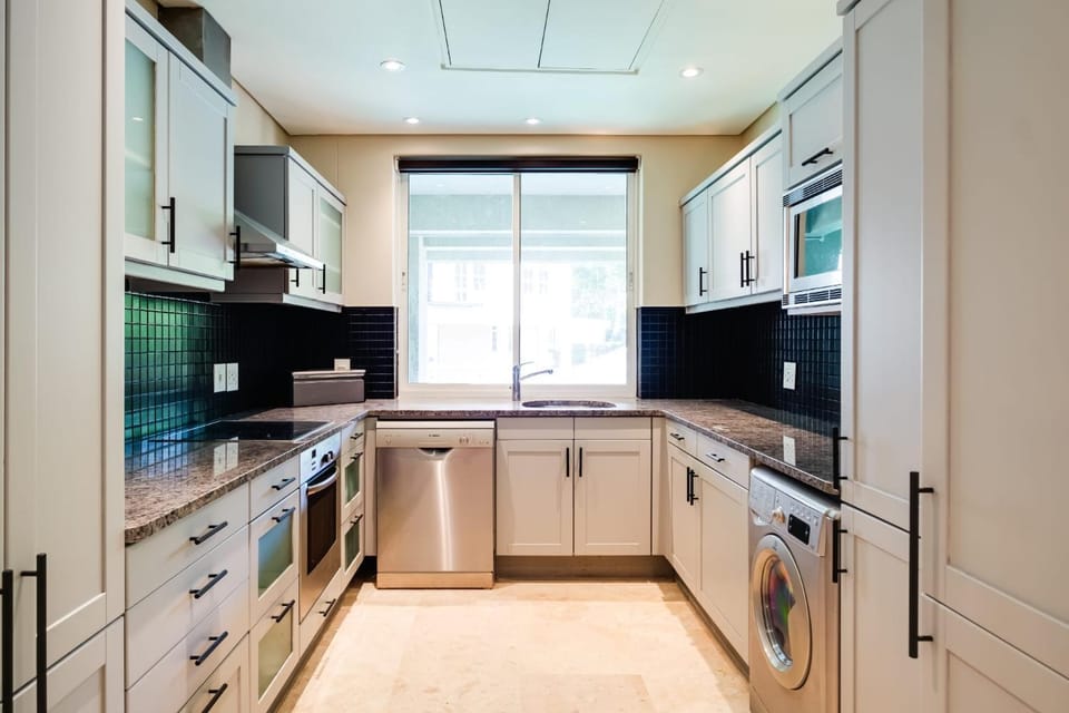Kitchen or kitchenette, dishwasher, oven, stove