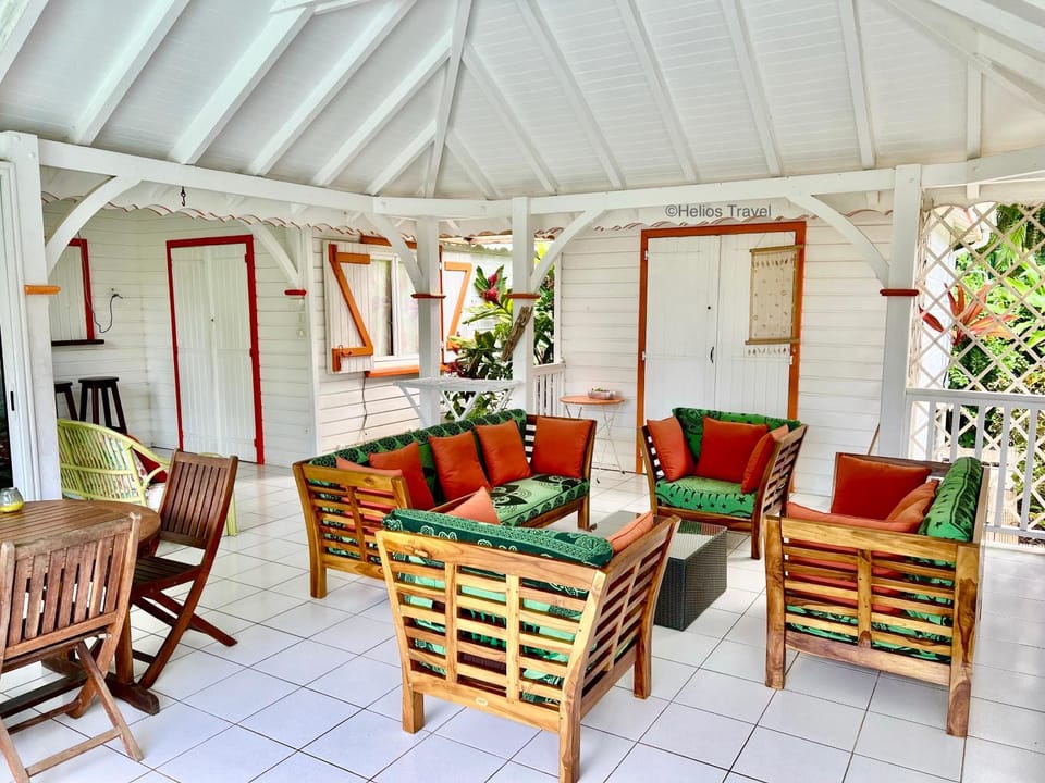 Property building, Patio, Day, Living room, Seating area, Dining area