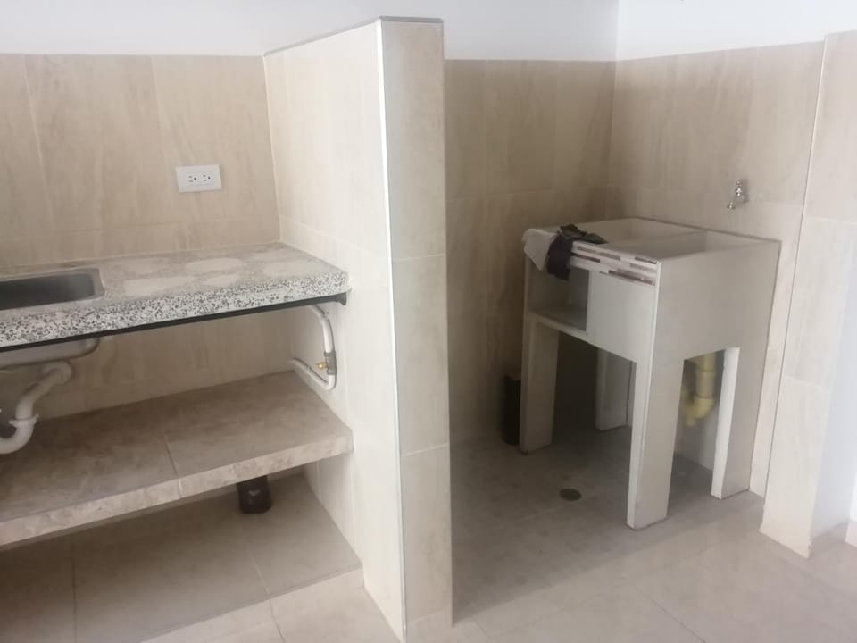 Kitchen or kitchenette, washing machine