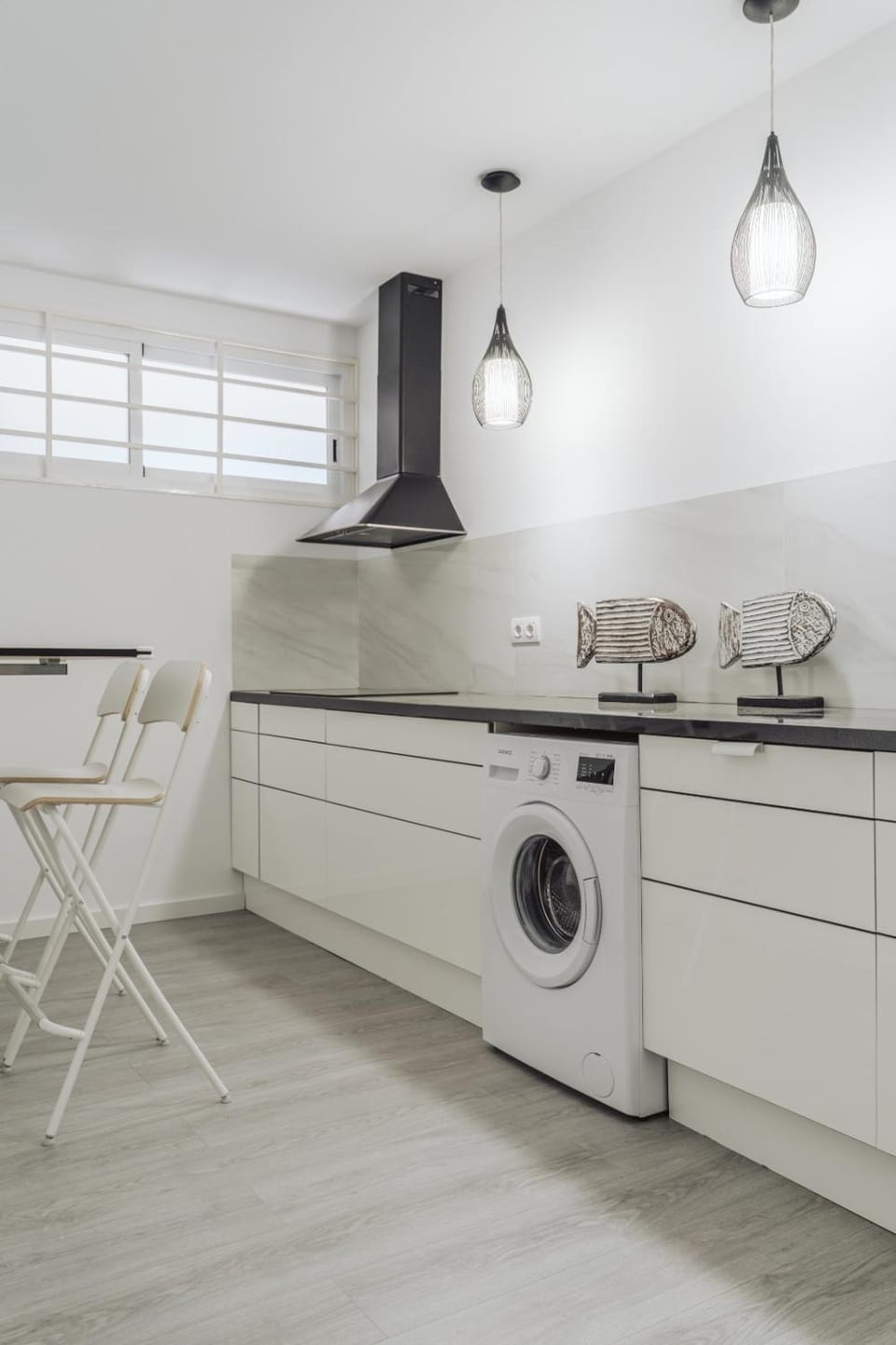 Kitchen or kitchenette, dishwasher, stove, washing machine