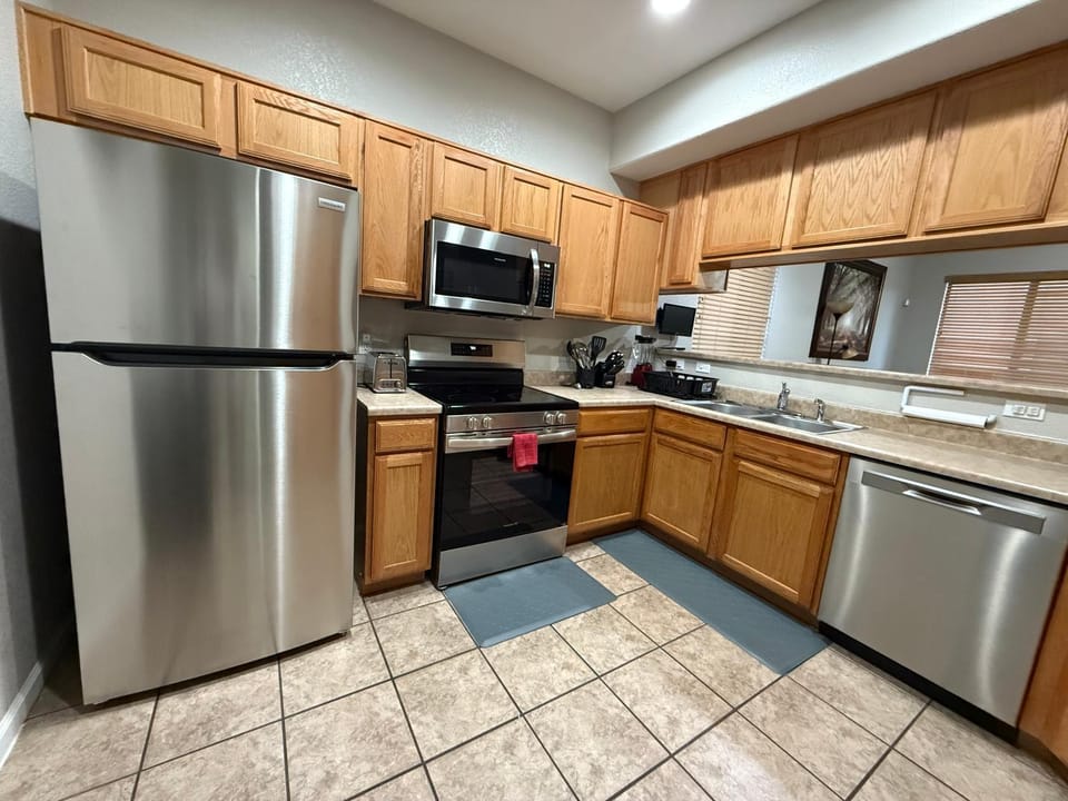 Kitchen or kitchenette, dishwasher, microwave, oven, stove, toaster