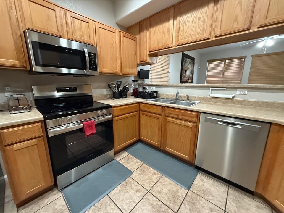 Kitchen or kitchenette, dishwasher, oven, stove, toaster