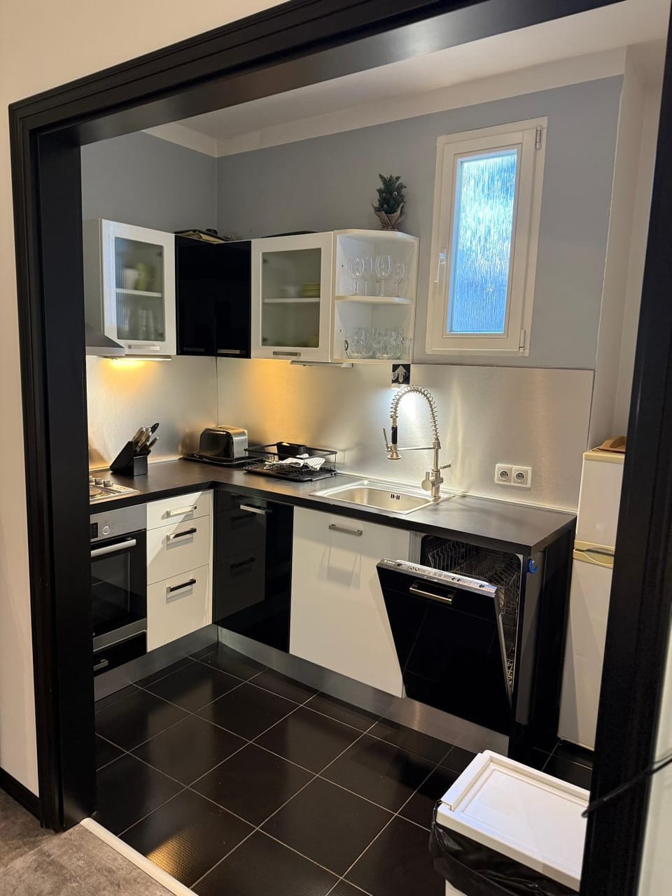 Kitchen or kitchenette, dishwasher, microwave, oven, stove