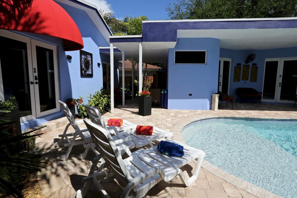 Property building, Patio, Pool view, Swimming pool, sunbed