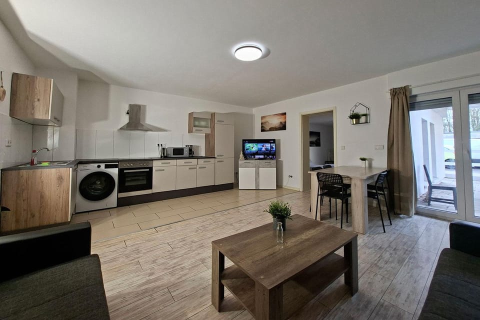 TV and multimedia, Kitchen or kitchenette, Living room, Seating area, Dining area, oven, stove, washing machine
