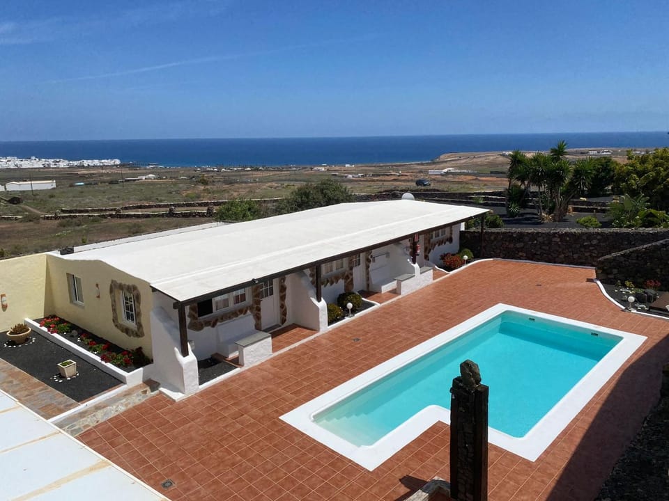 Property building, Day, Natural landscape, View (from property/room), Pool view, Swimming pool, sunbed