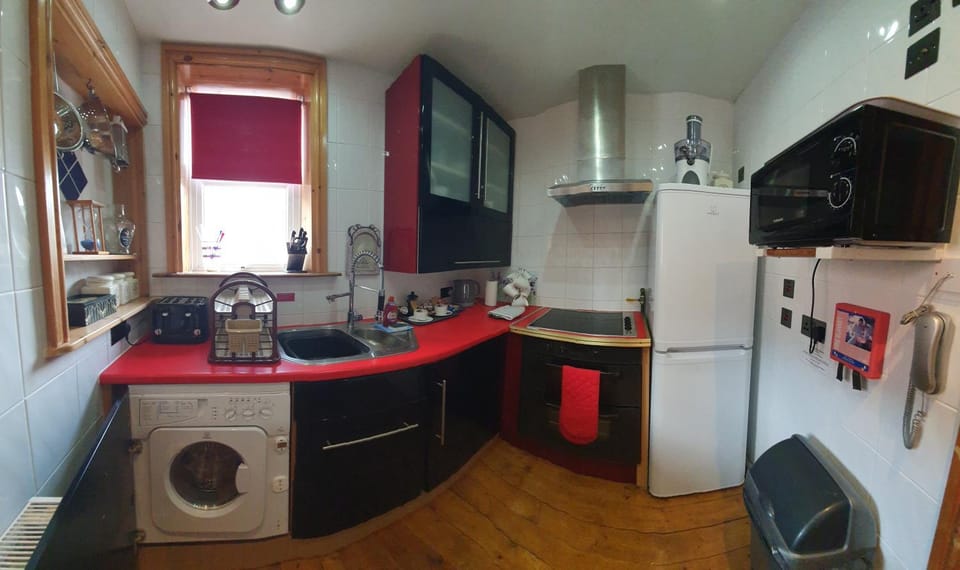 Kitchen or kitchenette, microwave, oven, stove, toaster, washing machine, kitchen