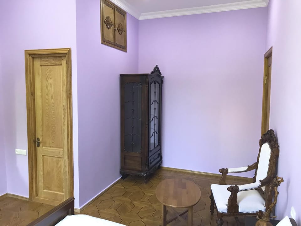 Bed, Seating area, wardrobe
