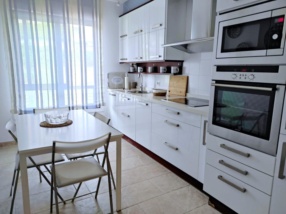 Photo of the whole room, dishwasher, microwave, oven, stove, kitchen