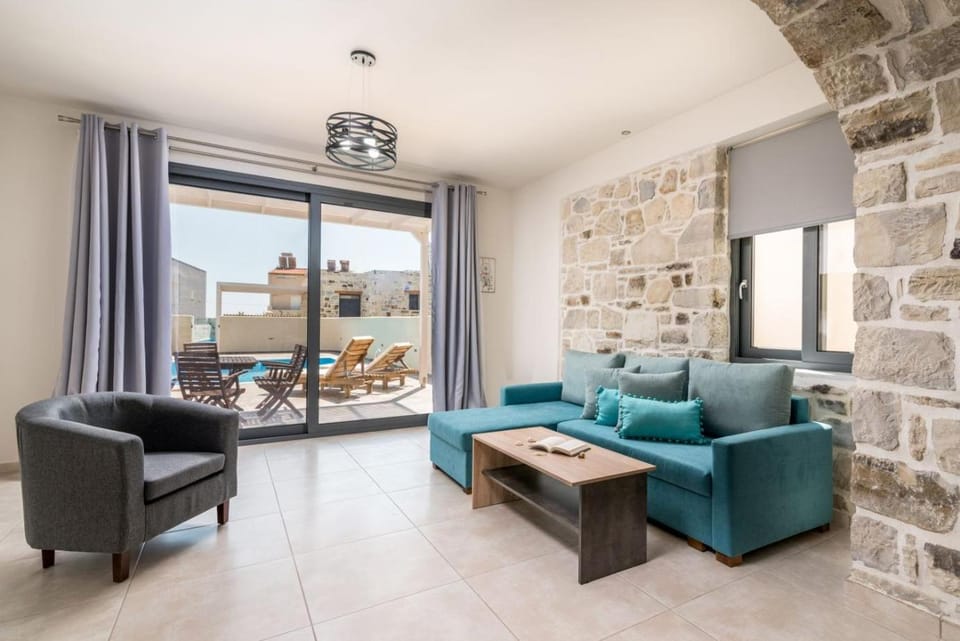 Living room, Seating area, Pool view