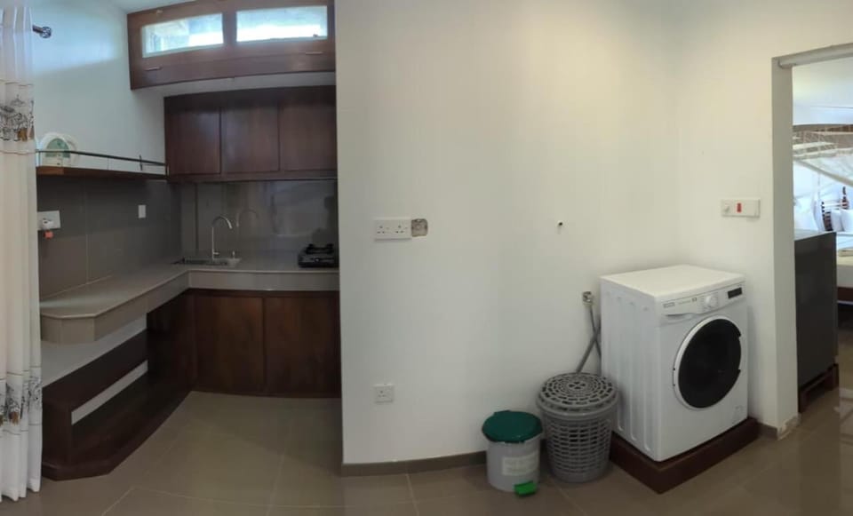 Kitchen or kitchenette, washing machine