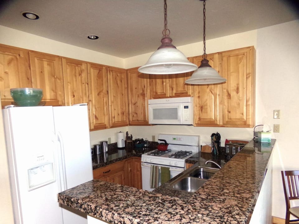 Kitchen or kitchenette, dishwasher, oven, stove