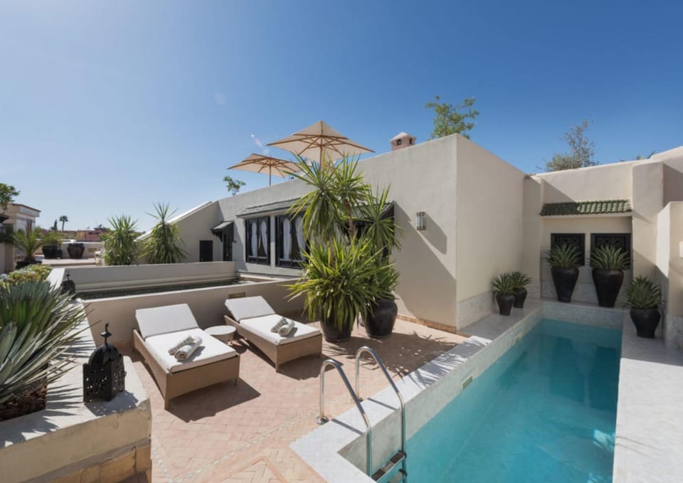 Property building, Patio, Day, View (from property/room), Balcony/Terrace, Living room, Seating area, Pool view, Swimming pool, Swimming pool, sunbed