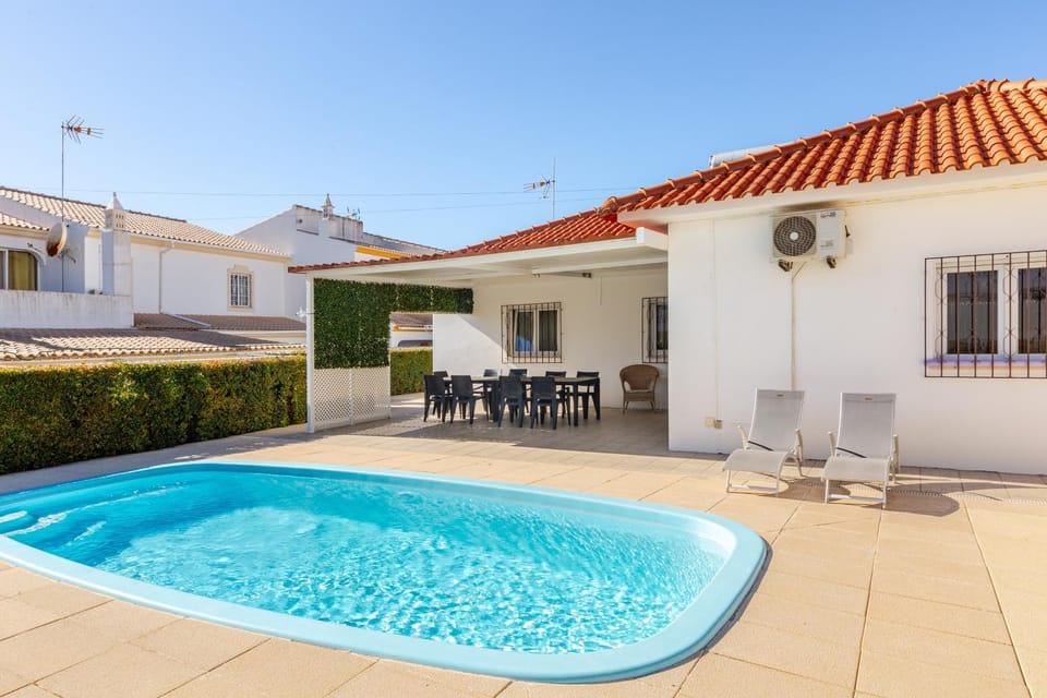 Property building, Patio, Living room, Pool view, Swimming pool, sunbed