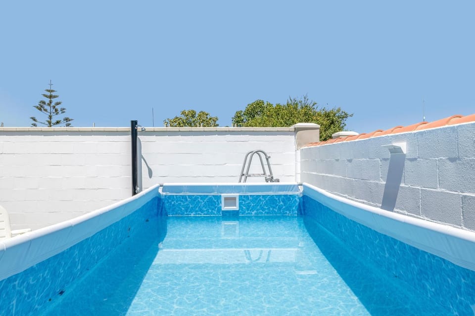 Property building, Living room, Swimming pool