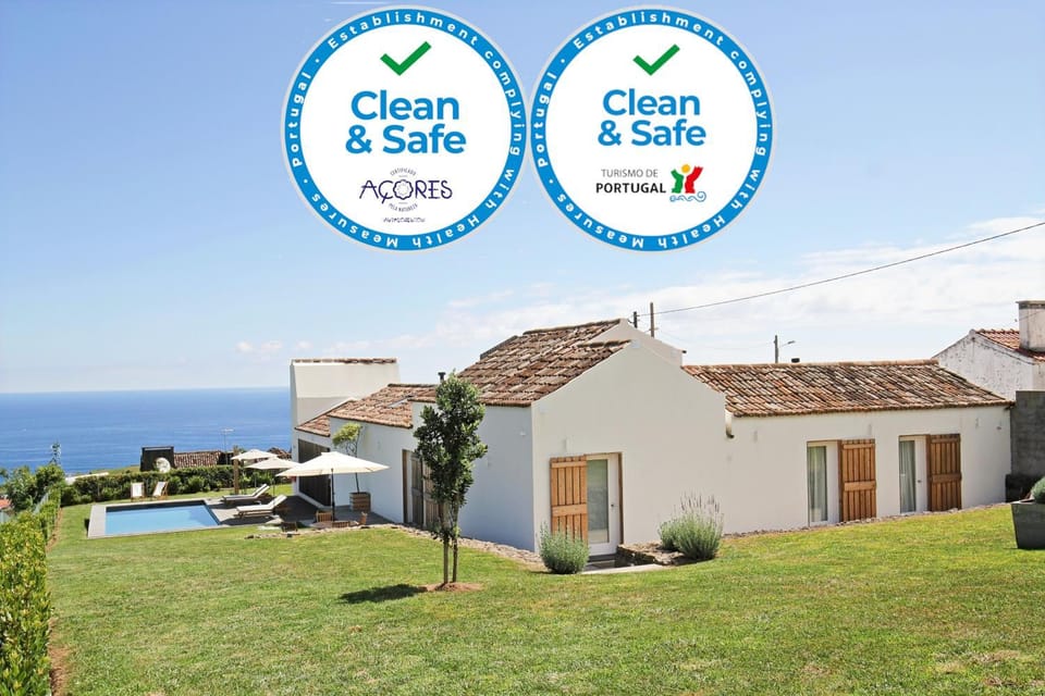 Property building, Facade/entrance, Day, Natural landscape, Garden, Logo/Certificate/Sign, Garden view, Pool view, Sea view, Swimming pool, Certificate/Award, sunbed