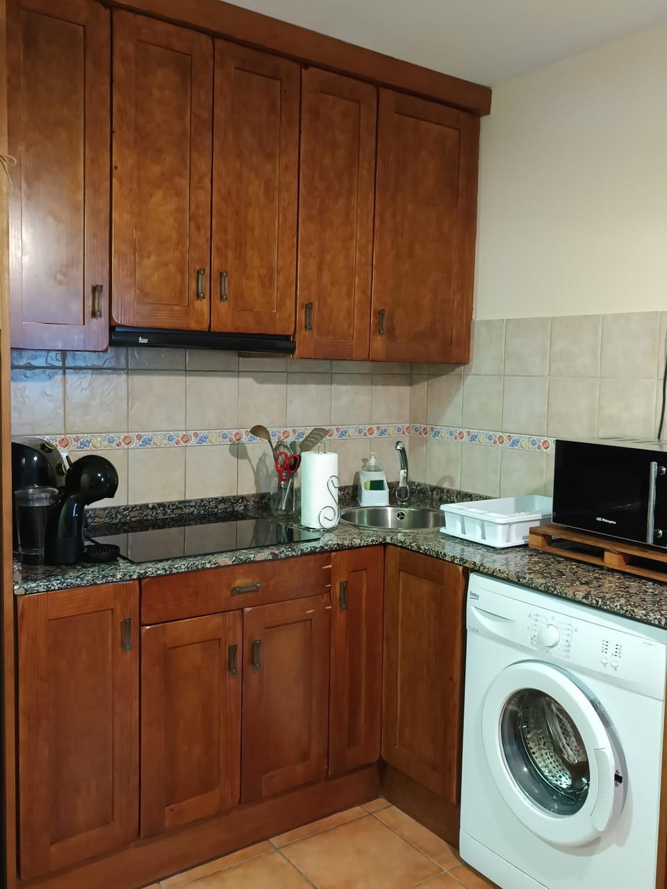 Kitchen or kitchenette, washing machine