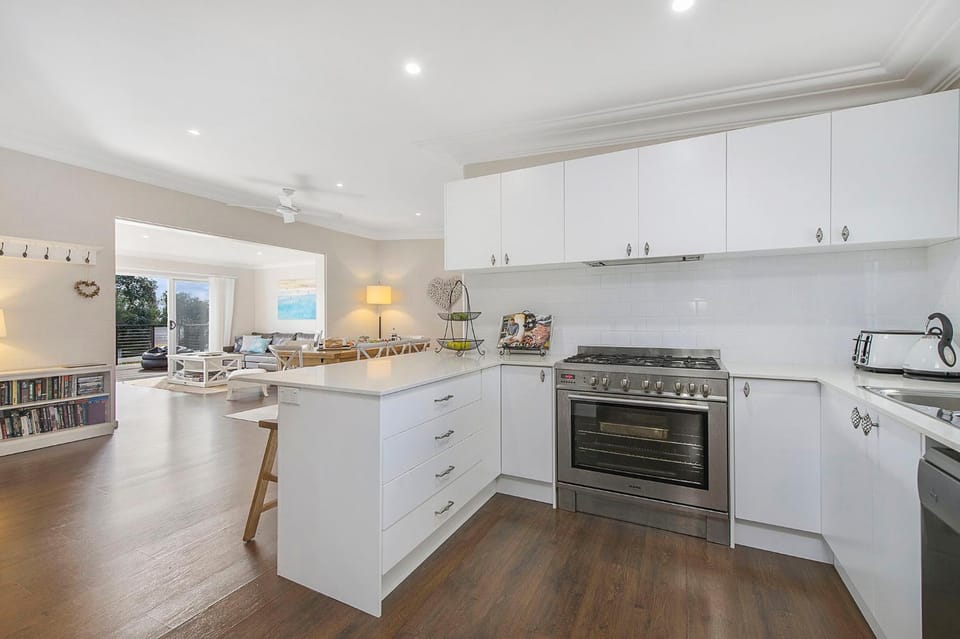 Kitchen or kitchenette, dishwasher, oven, stove