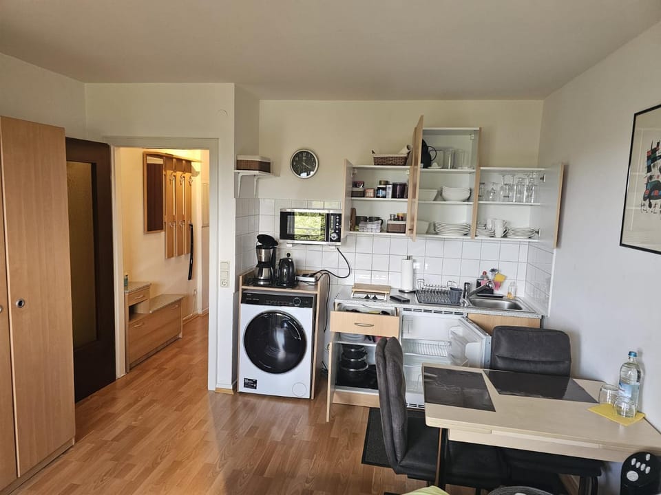 Kitchen or kitchenette, Dining area, stove, washing machine, dryer